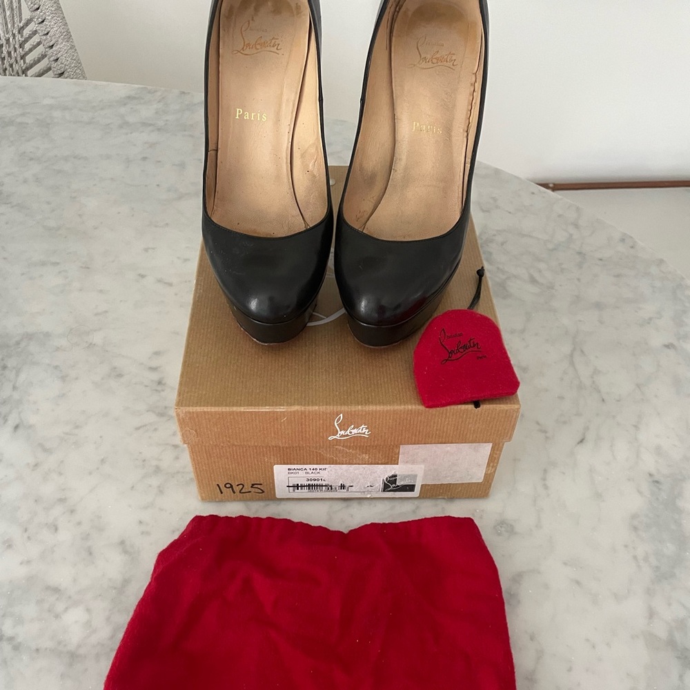 Authentic Bianca, Christian Louboutin size 40 1/2 runs small.